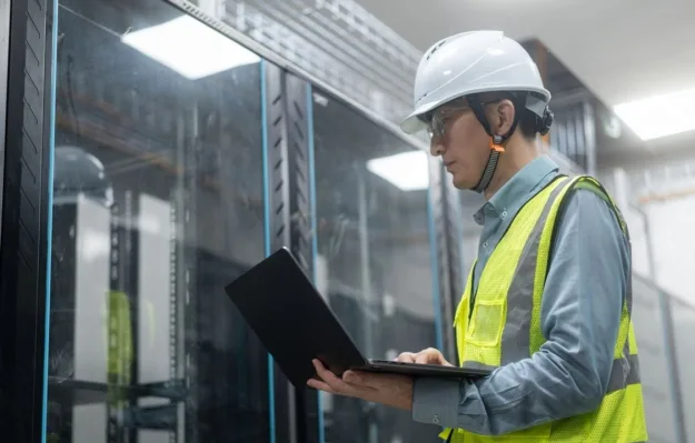 Technician managing connected UPS infrastructure